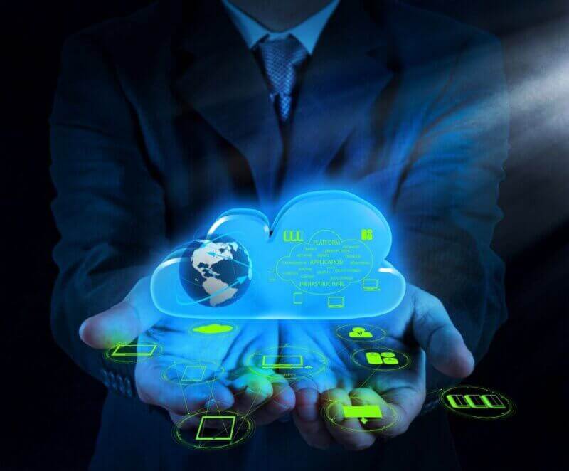 Proactive IT Monitoring Maintenance Man holding an IT cloud with managed IT services inside