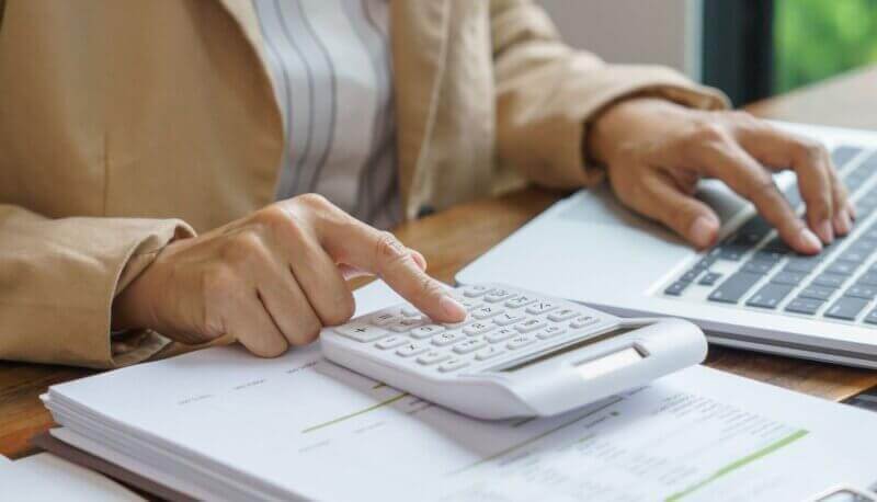 IT-Cost-Efficiency-Review Calculator and laptop for cost review