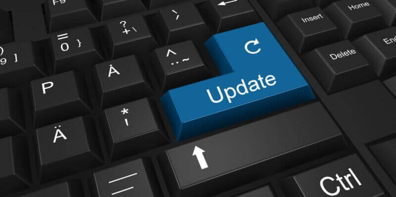 Updates-and-patch-management Blue Update button on a black keyboard